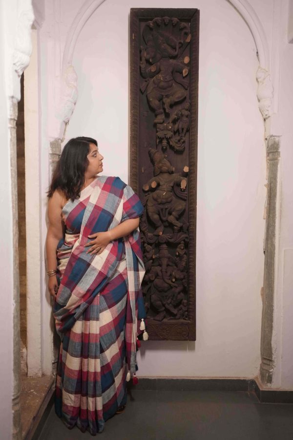 Patanga multicolor check cotton saree with multicolored tassels, includes solid blouse in a soft complementary color.